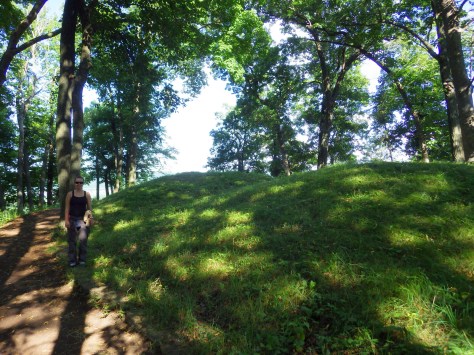 Tiff next to two of the tallest mounds in the park